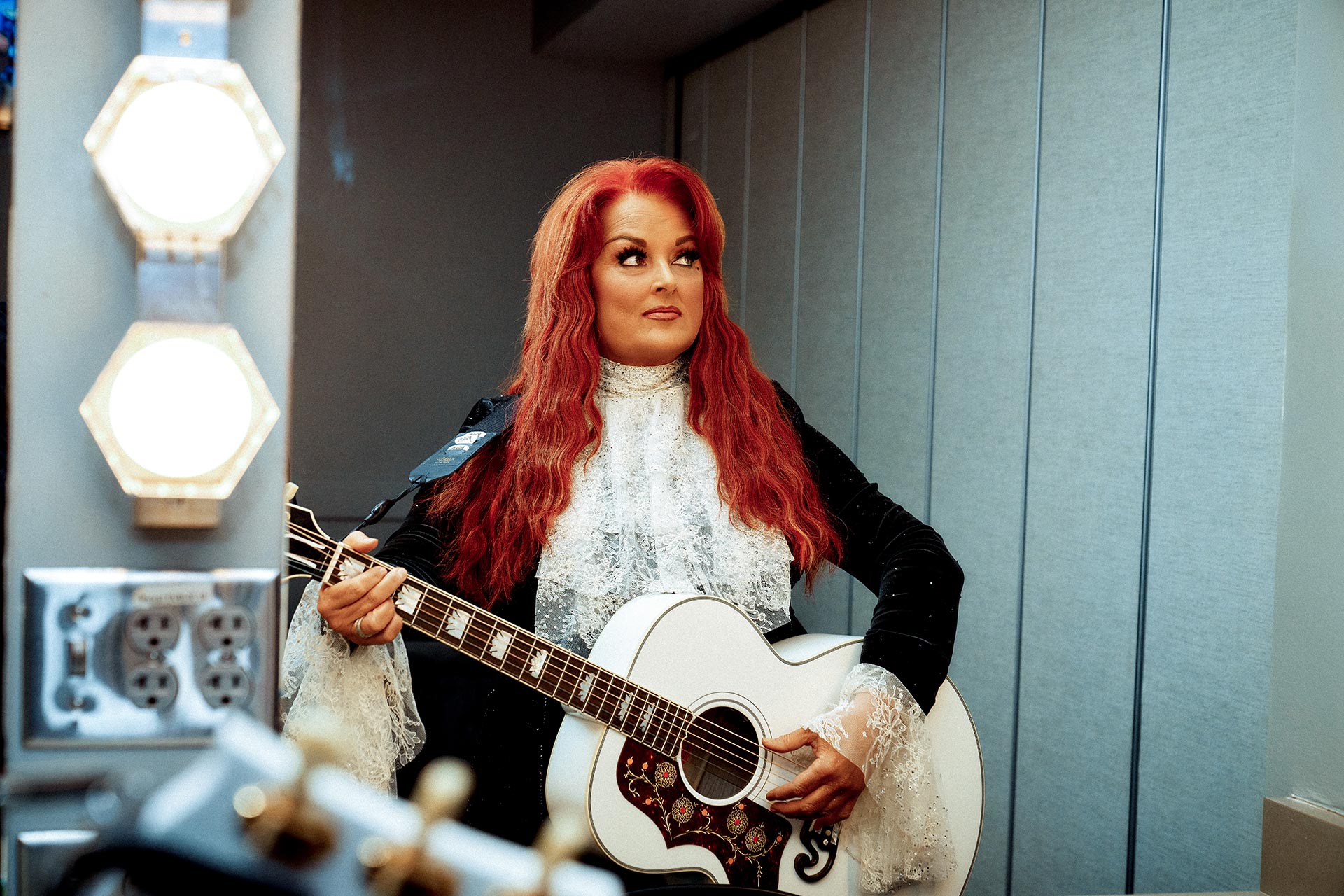 Wynonna backstage with guitar